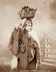 Woman with a basket of fruit on her head, c.1867-98